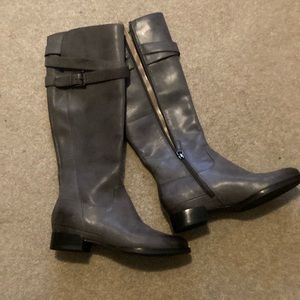 Dark gray tall leather boots with zippers and biker at top